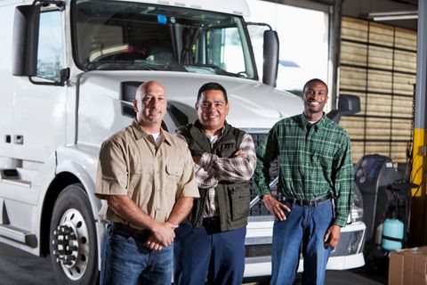 Fleet owners standing in front of a tractor unit